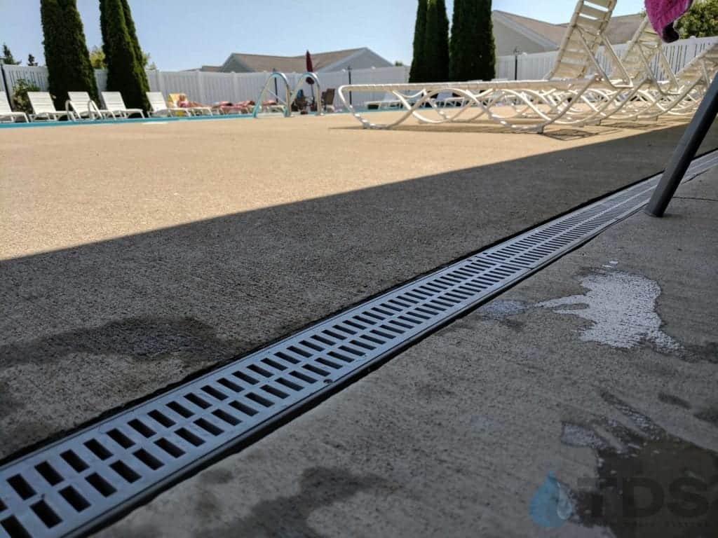 NDS Mini Channel Gray Slotted grate stainless steel pool side | TDS- Trench Drain Systems